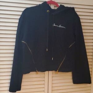 Versace like sweatshirt with hoodie, gold zippers and colorful face and logo.